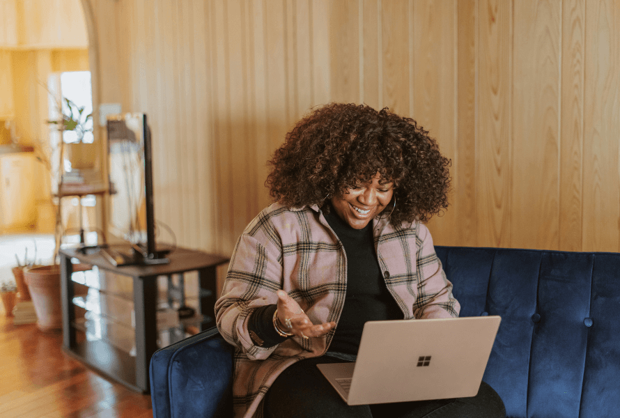 Woman using laptop to join in on Colson Fellows conversation